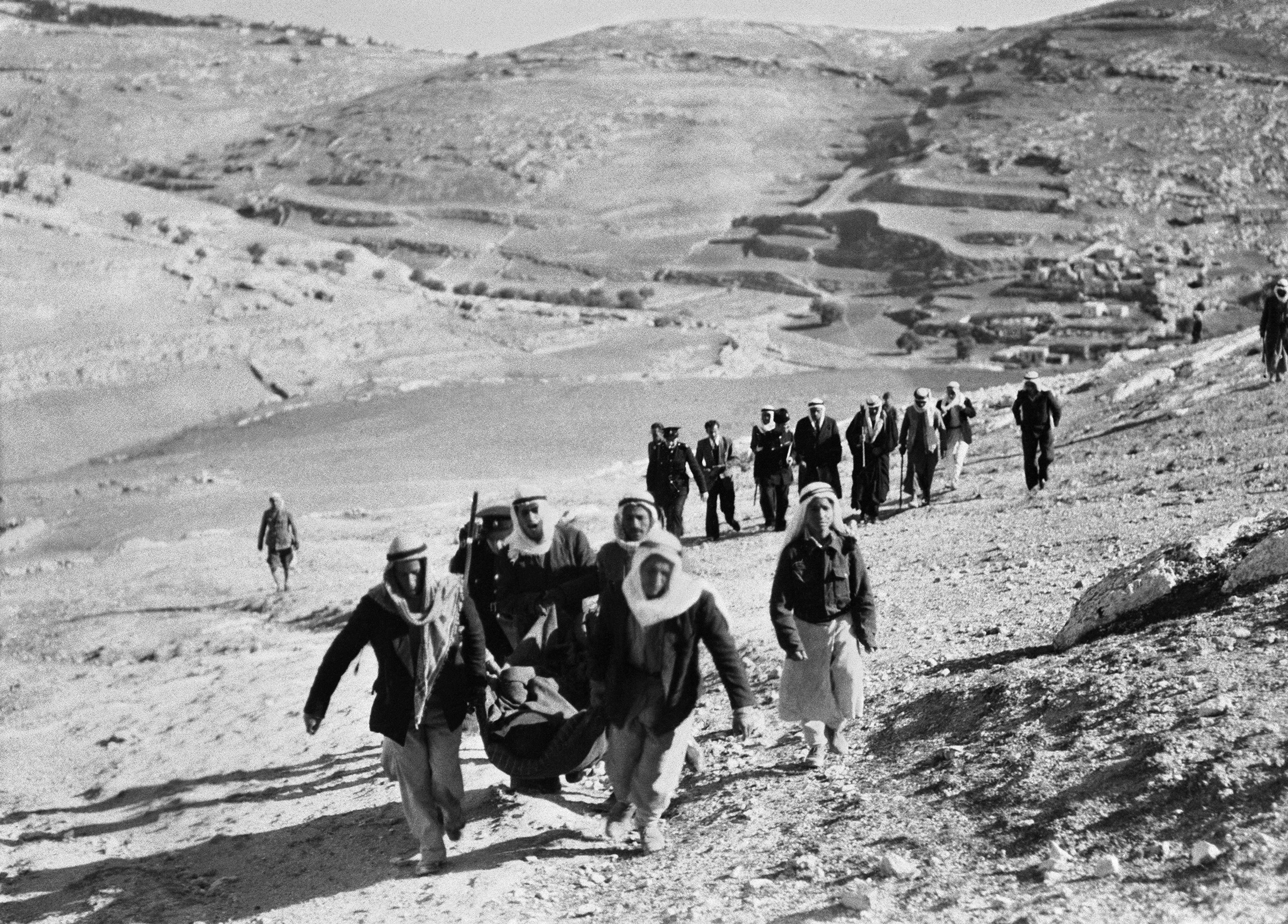 Palestinians leave their Jerusalem neighborhood during the 1948 Arab-Israeli War.