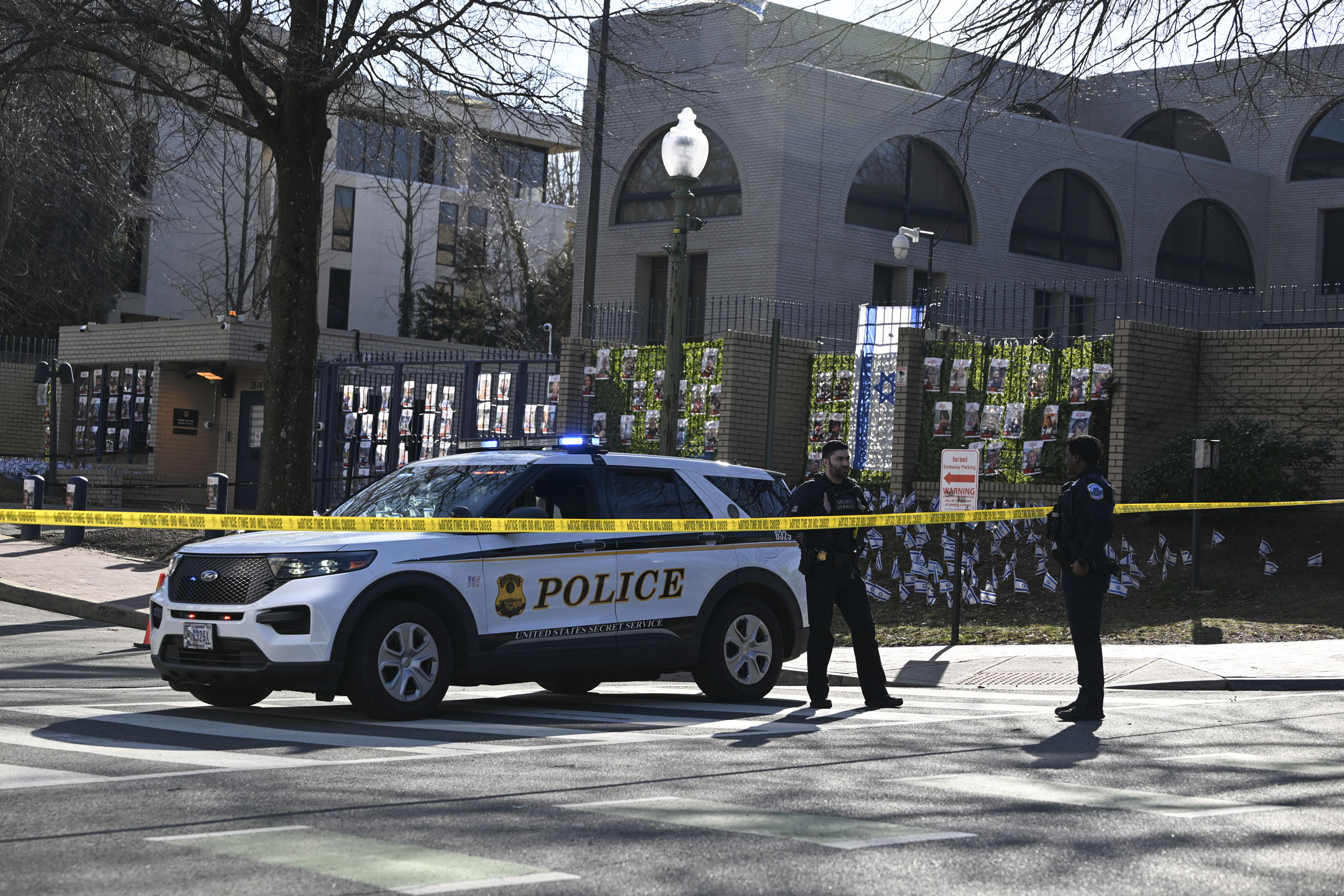 Police take security measures and investigate the crime scene after 25-year-old Aaron Bushnell, an active-duty member of the US Air Force, set himself on fire Sunday outside the Israeli Embassy in Washington, D.C.