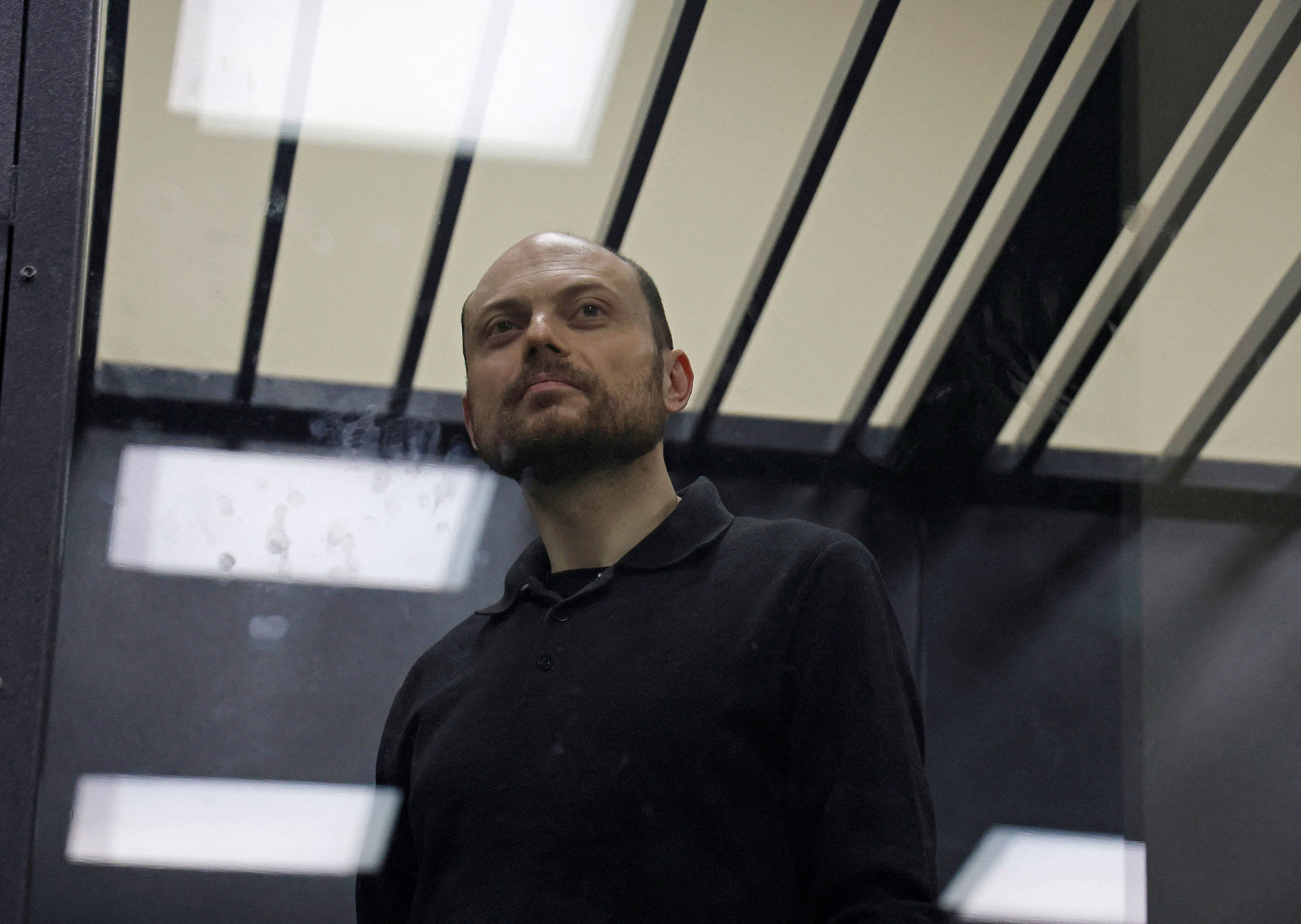 Jailed Russian opposition figure Vladimir Kara-Murza stands behind a glass wall of an enclosure for defendants during a court hearing to consider an appeal against his prison sentence, in Moscow, Russia July 31, 2023.