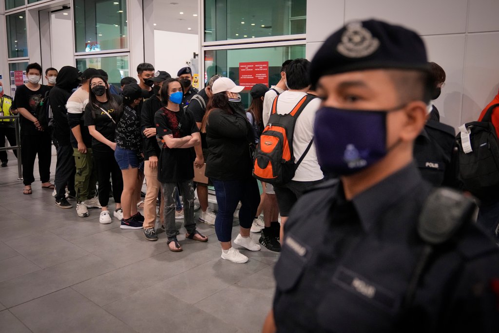 Malaysian youths rescued from human traffickers in Cambodia arrive at Kuala Lumpur Airport on Sept. 9, 2022.