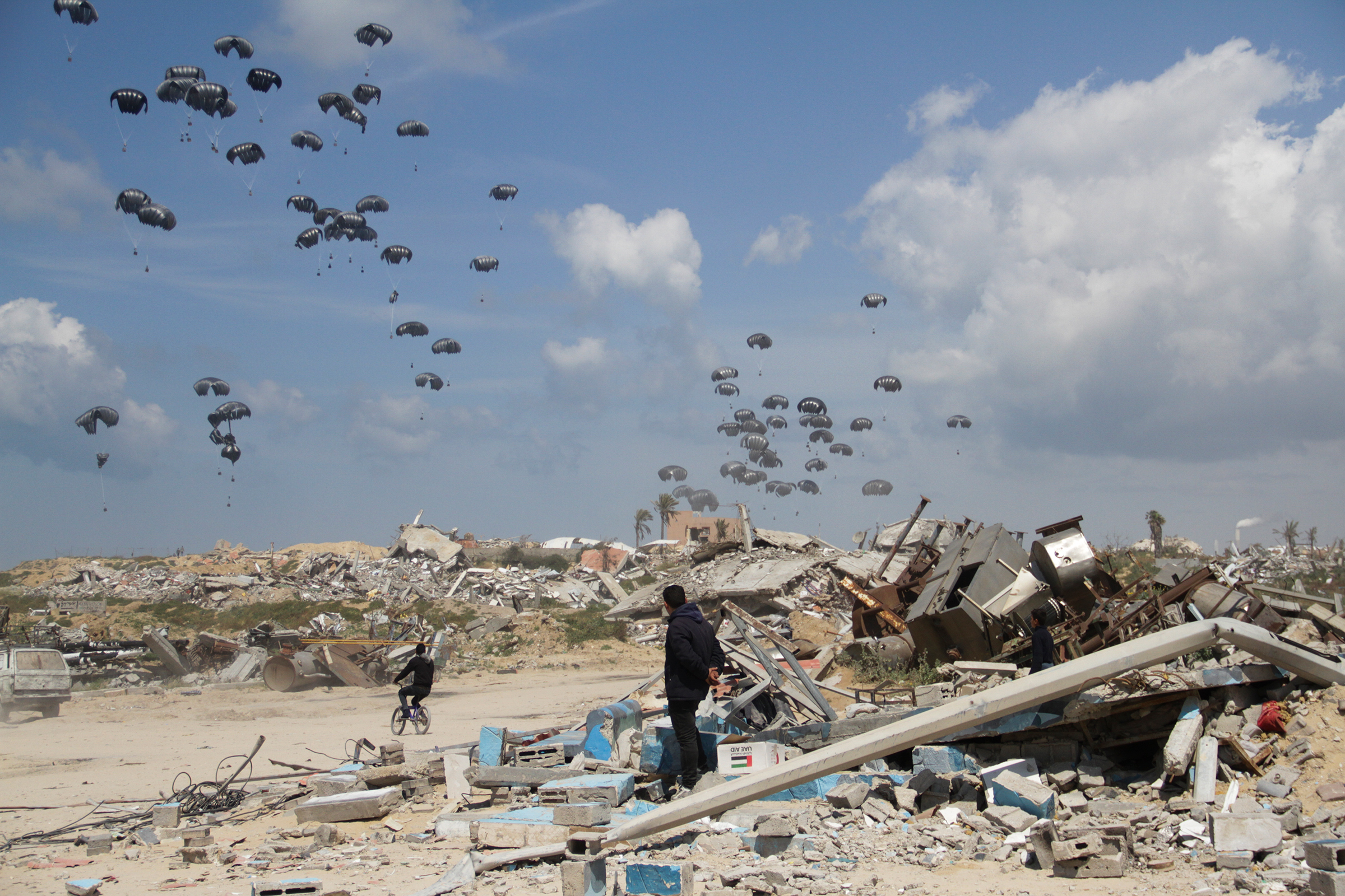 Humanitarian aid is airdropped to Palestinians over Gaza City on March 25, 2024.