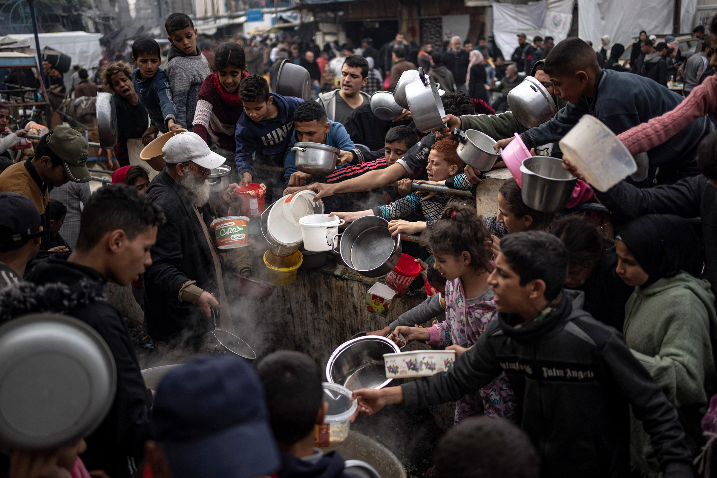 Palestinians line up for a free meal in Rafah, Gaza Strip, on Dec. 21, 2023.