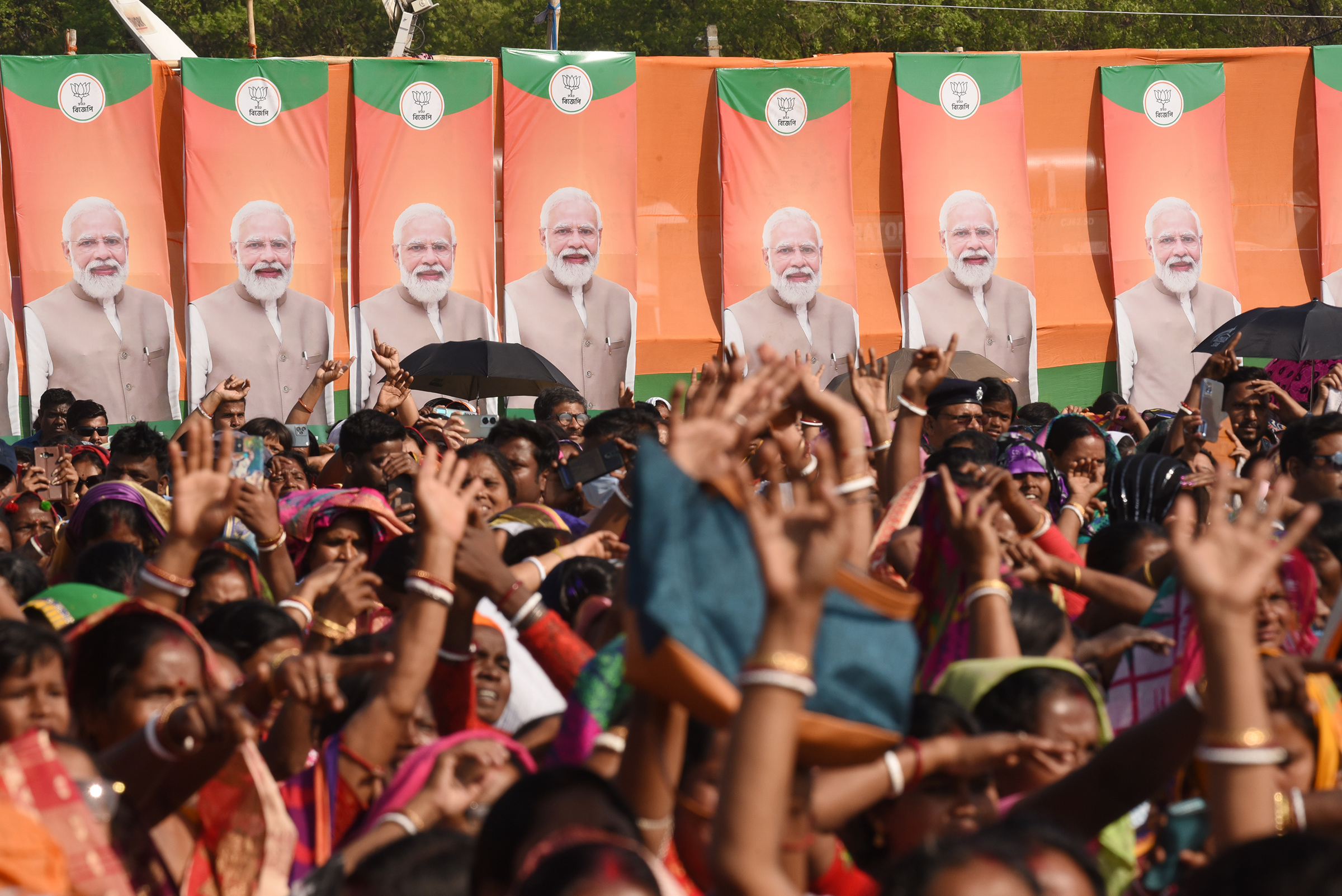 BJP supporters greet Prime Minister Narendra Modi during a rally in Arambagh, India, on March 1.