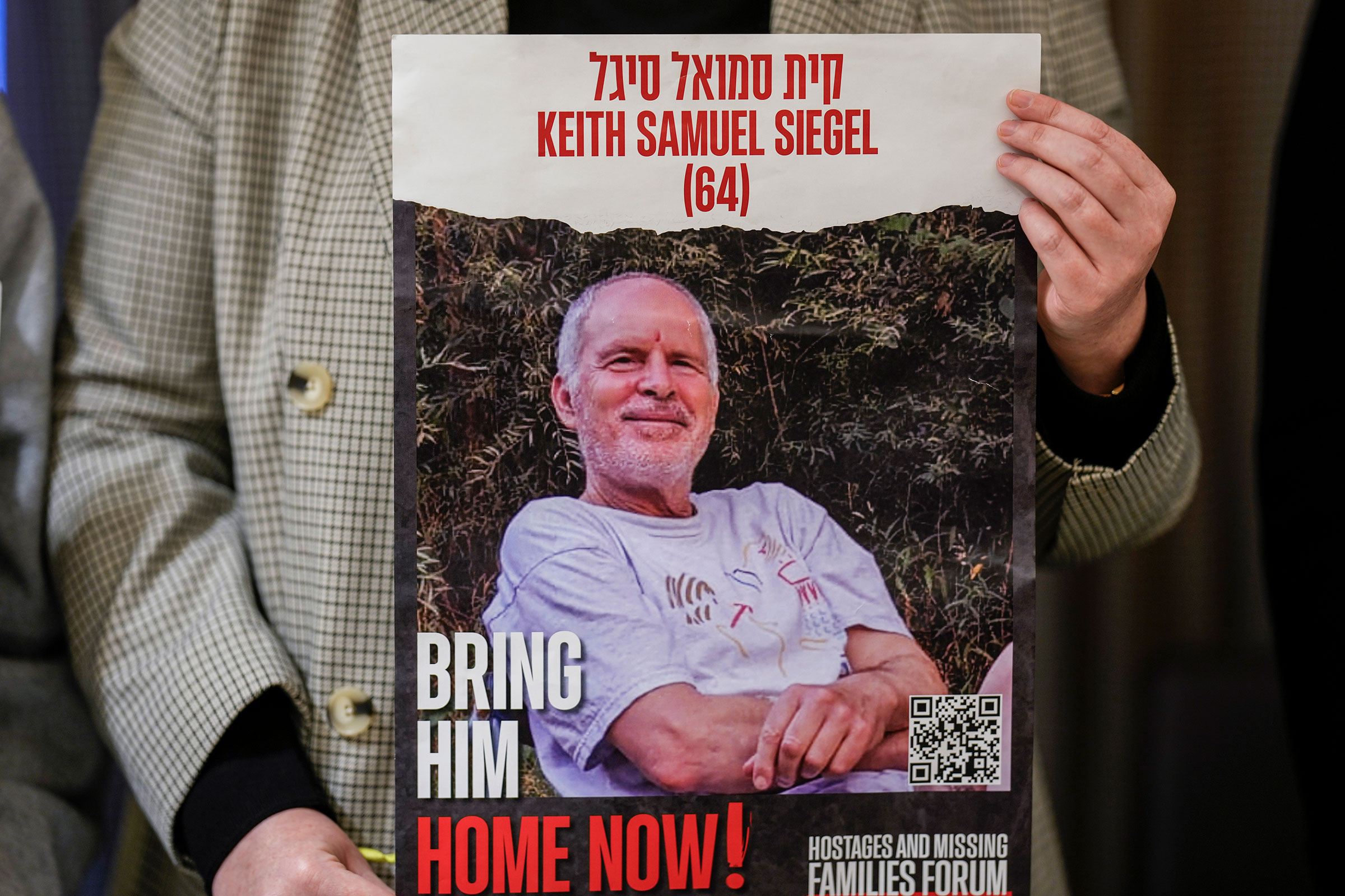 Tal Wax holds a poster with a photograph of her uncle Keith Samuel Siegel, an Israeli-American hostage held in Gaza since the Oct. 7 attacks by Hamas during a press conference in Madrid, Spain, on Jan. 25, 2024.