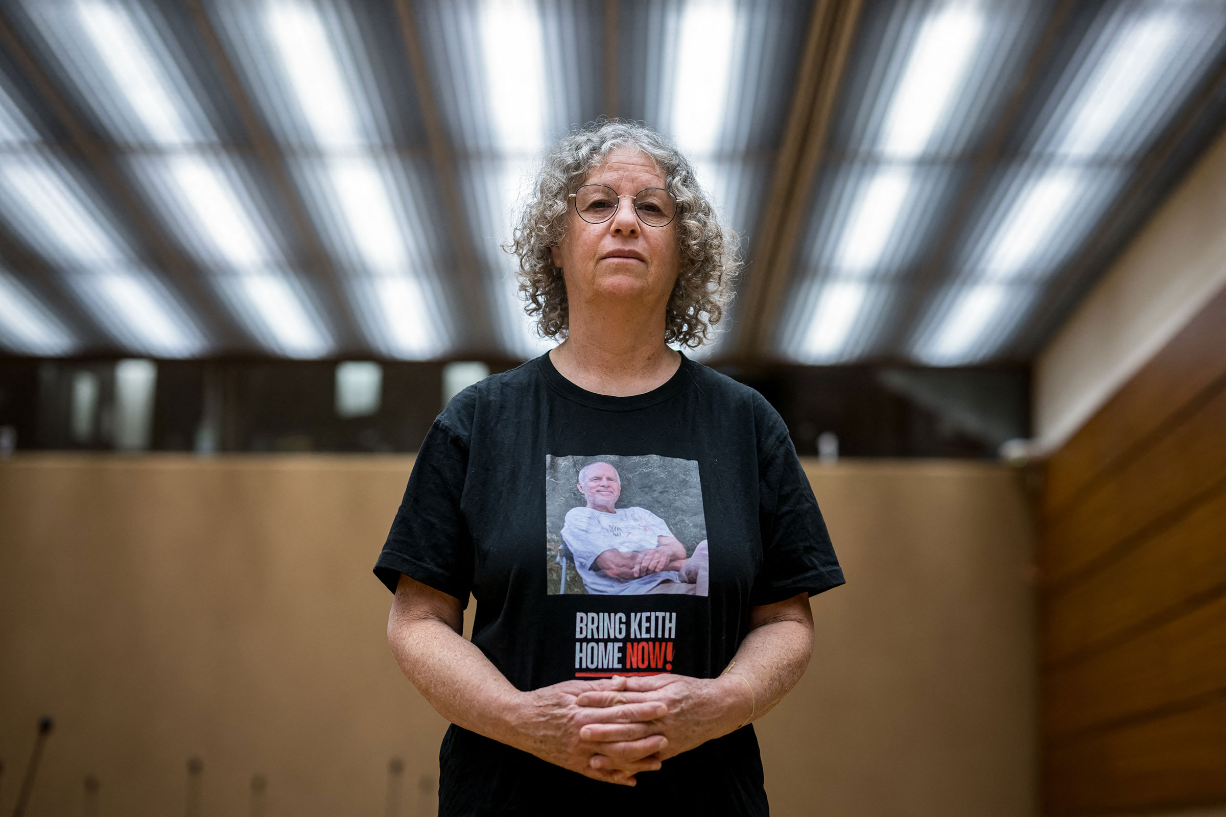 Former Hamas hostage Aviva Siegel poses with a t-shirt showing a picture of her husband Keith Siegel during an interview with AFP during her visit to the 55th session of the UN Human Rights Council in Geneva on Feb. 28, 2024.