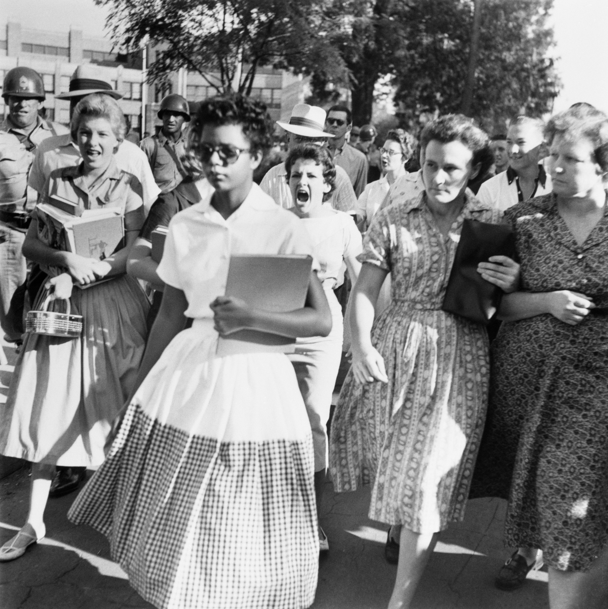 Elizabeth Eckford ignores the screams and stares of fellow students on her first day of school, Sept. 6, 1957. Eckford was one of nine African American students whose integration into Little Rock's Central High School was ordered by a Federal Court following legal action by the National Association for the Advancement of Colored People (NAACP).