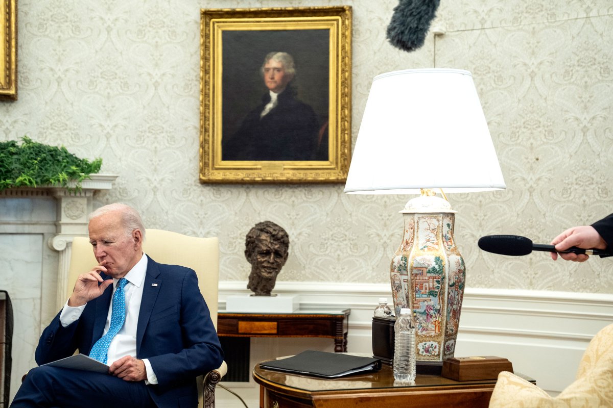 Joe Biden listens during a meeting in the oval office