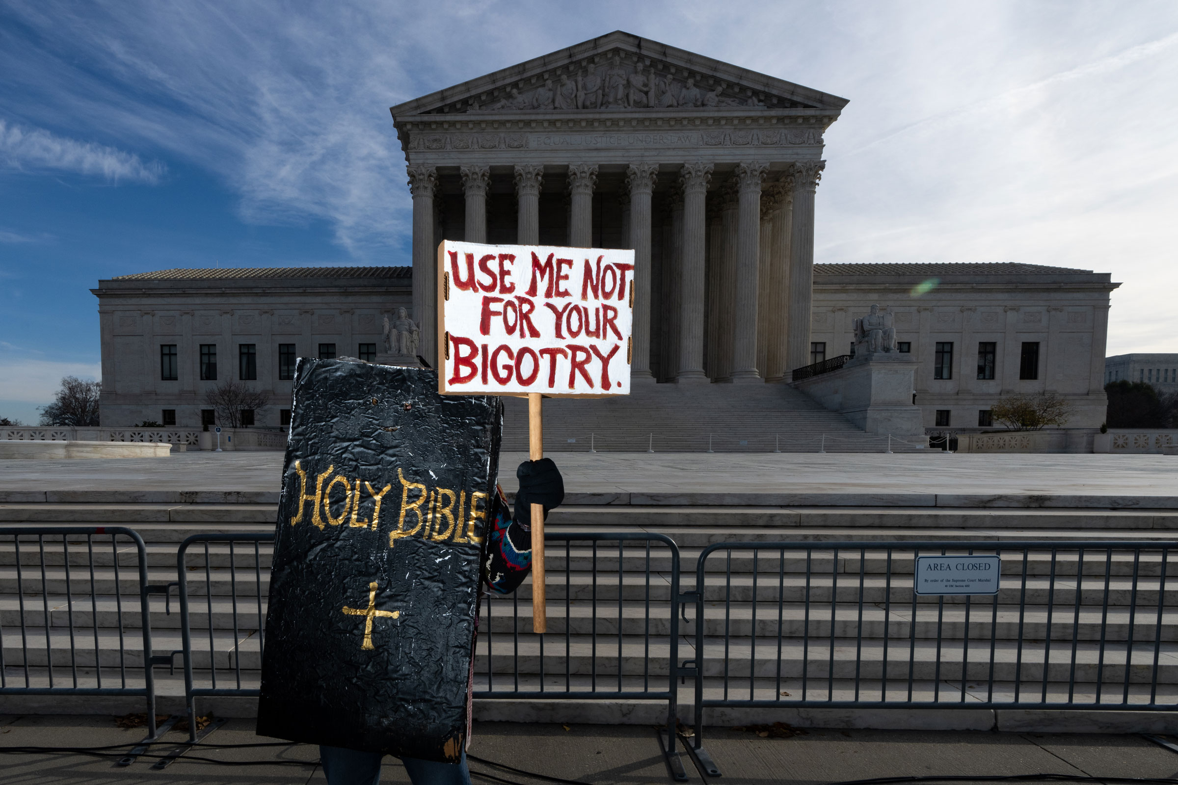 A protester dressed in a bible costume stands in front of the U.S. Supreme Court on Nov. 5, 2022.
