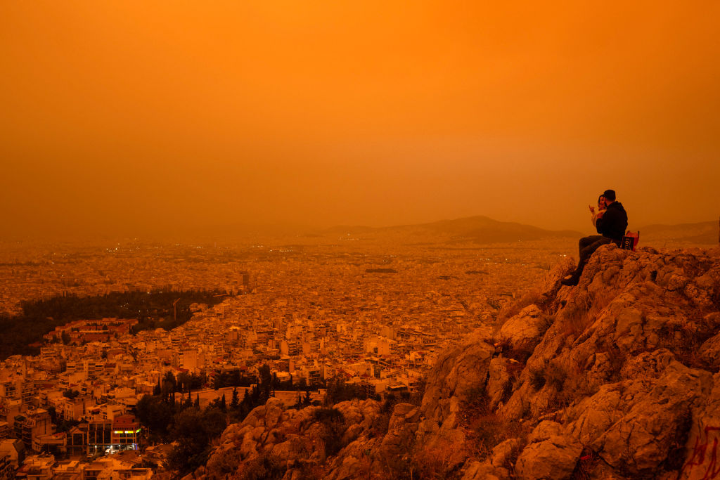 Athens Blanketed By Orange Haze Due To Sahara Dust Storm