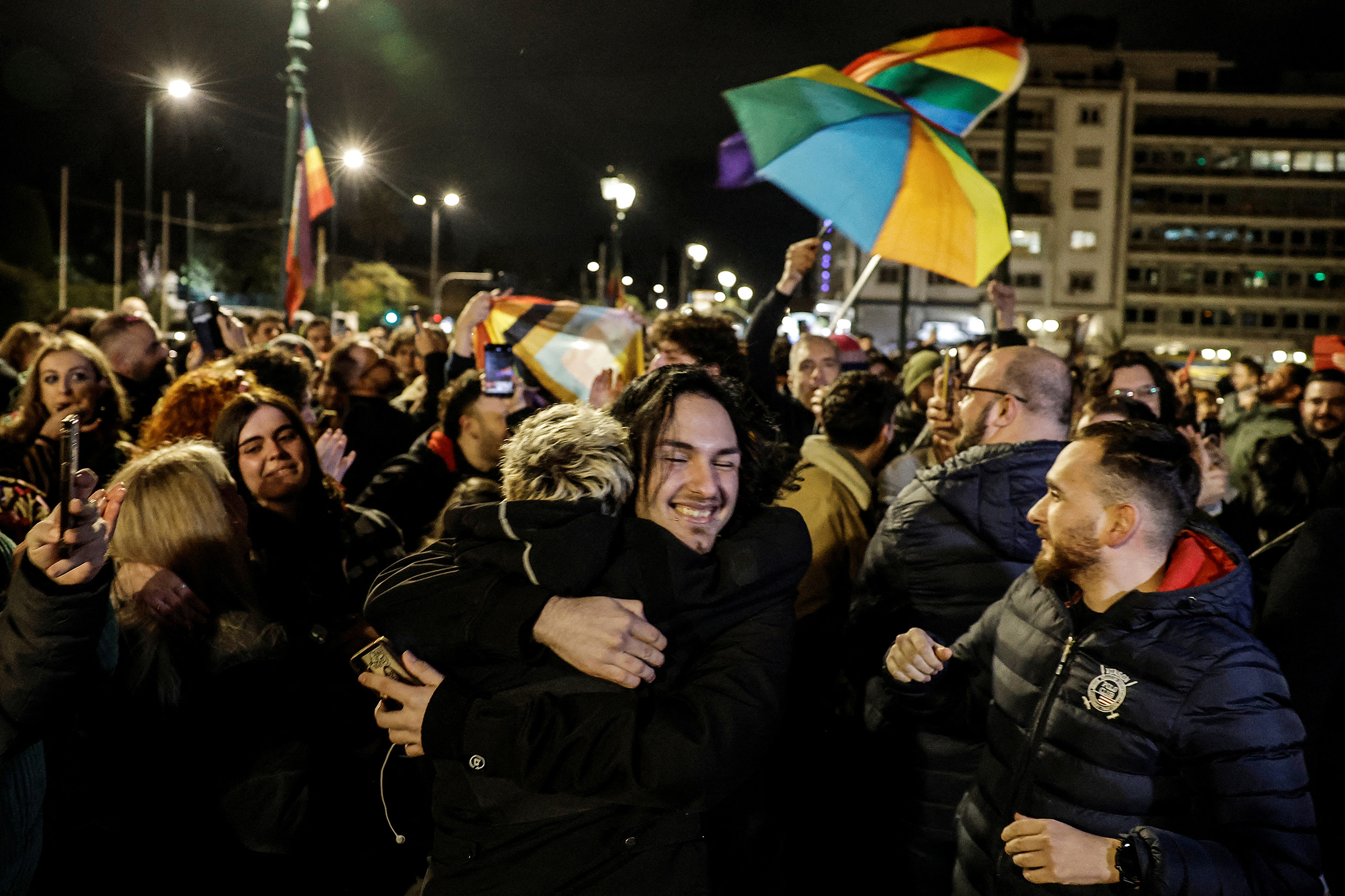 Members of the LGBTQ+ community and supporters celebrate in front of the Greek parliament, after the vote in favor of a bill approved allowing same-sex marriages, in Athens, Greece, Feb. 15, 2024.