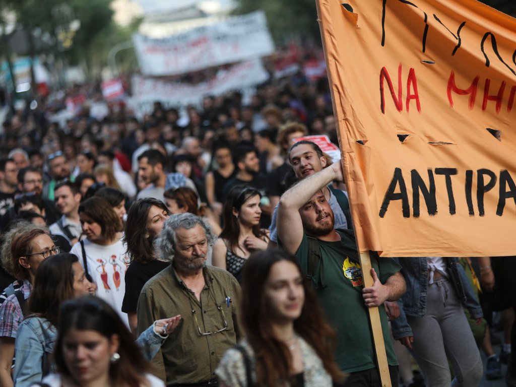 People take part in a protest on June 15, 2023 in Athens over the loss of hundreds of asylum seekers aboard a boat that capsized off the coast of Pylos.