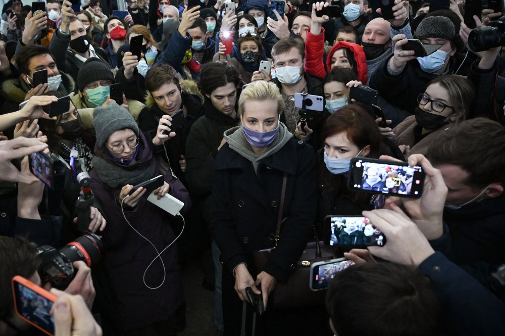 Navalnaya surrounded by people as she leaves Moscow's Sheremetyevo airport upon the arrival from Berlin on Jan. 17, 2021.
