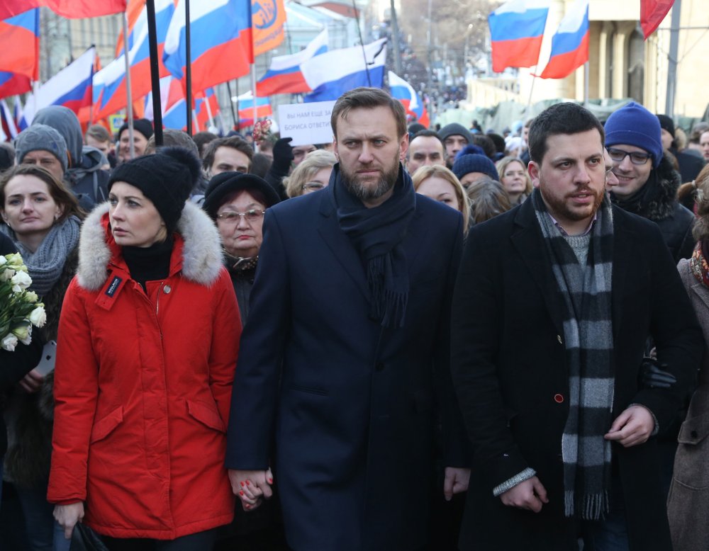 Alexei Navalny and Yulia Navalnaya attend a mass march marking the one-year anniversary of the killing of opposition leader Boris Nemtsov in Moscow, Russia on Feb. 27, 2016.