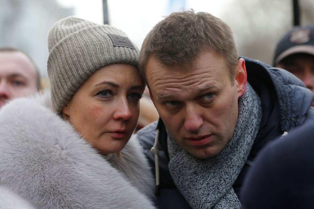 Yulia Navalnaya and Alexei Navalny take part in a march in memory of opposition leader Boris Nemtsov in Moscow, Russia, on Feb. 26, 2017.