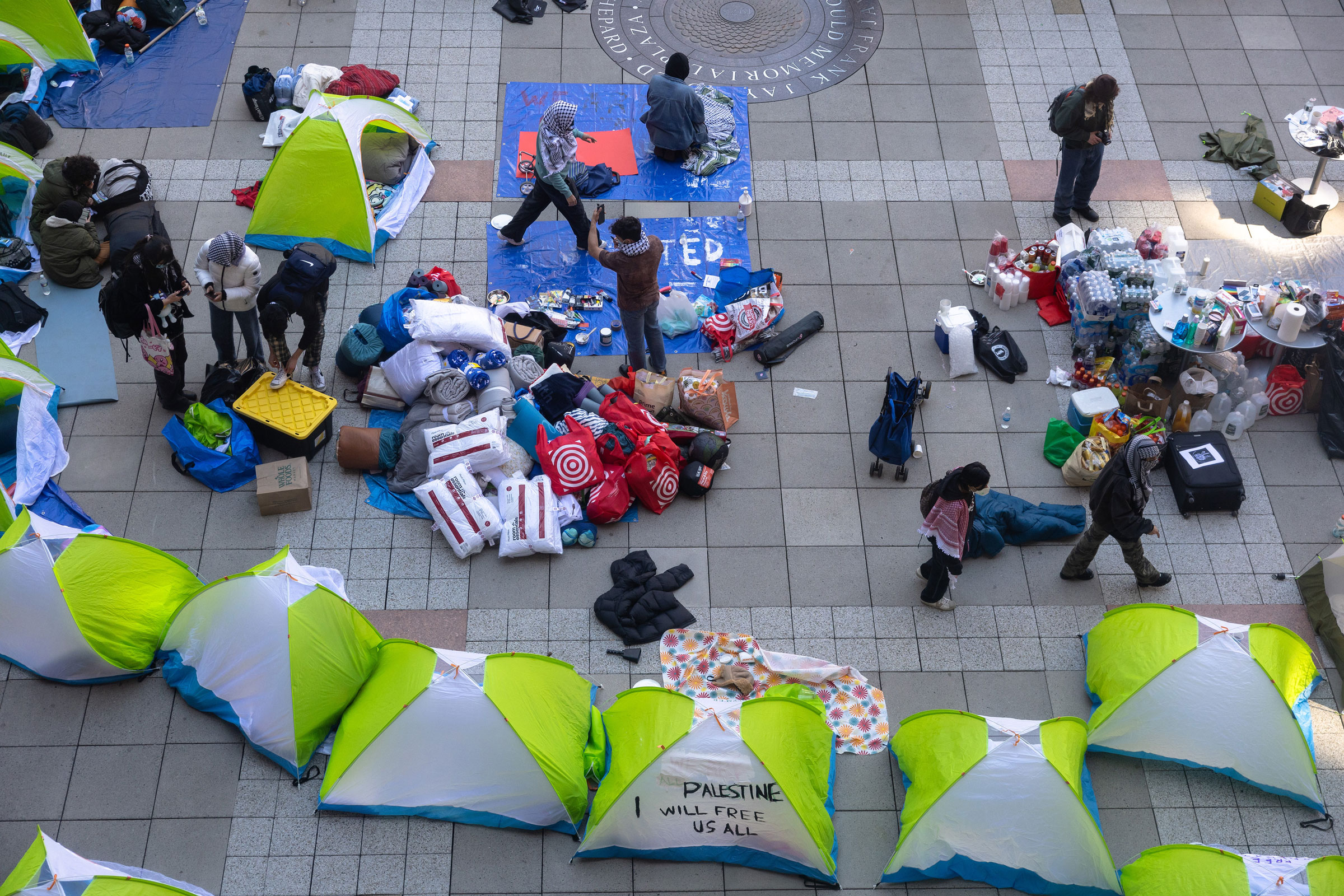 New York University students set up a “Liberated Zone” tent encampment in Gould Plaza at NYU Stern School of Business on April 22, 2024.