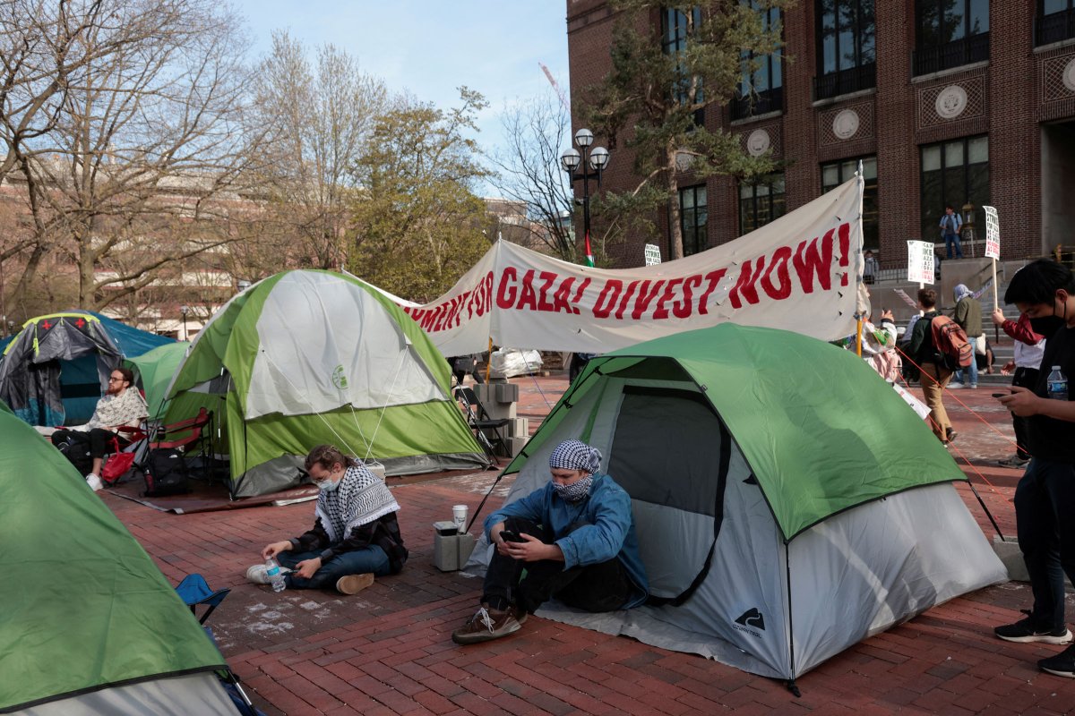 A coalition of University of Michigan students rally at an encampment to pressure the university to divest from Israel