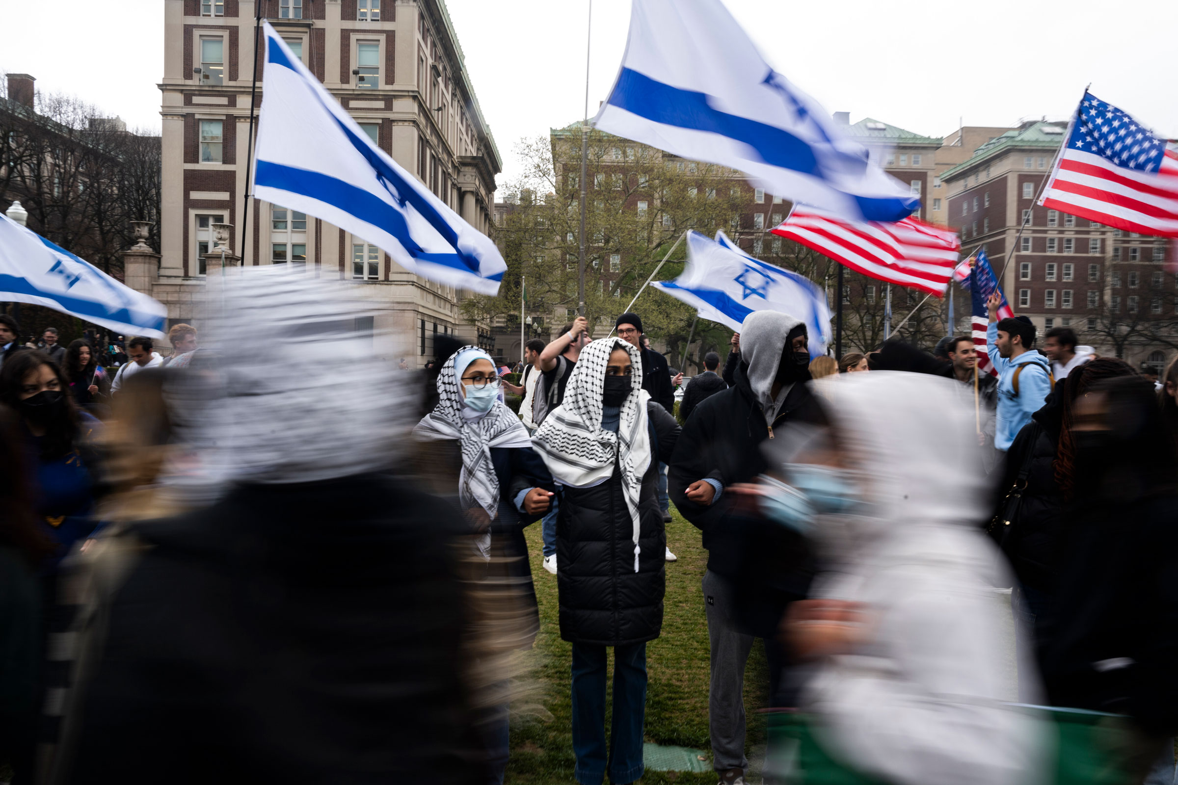 Students erect a line in front of pro-Israel students to protect a large pro-Palestine picket at Columbia University, on April 18, 2024.