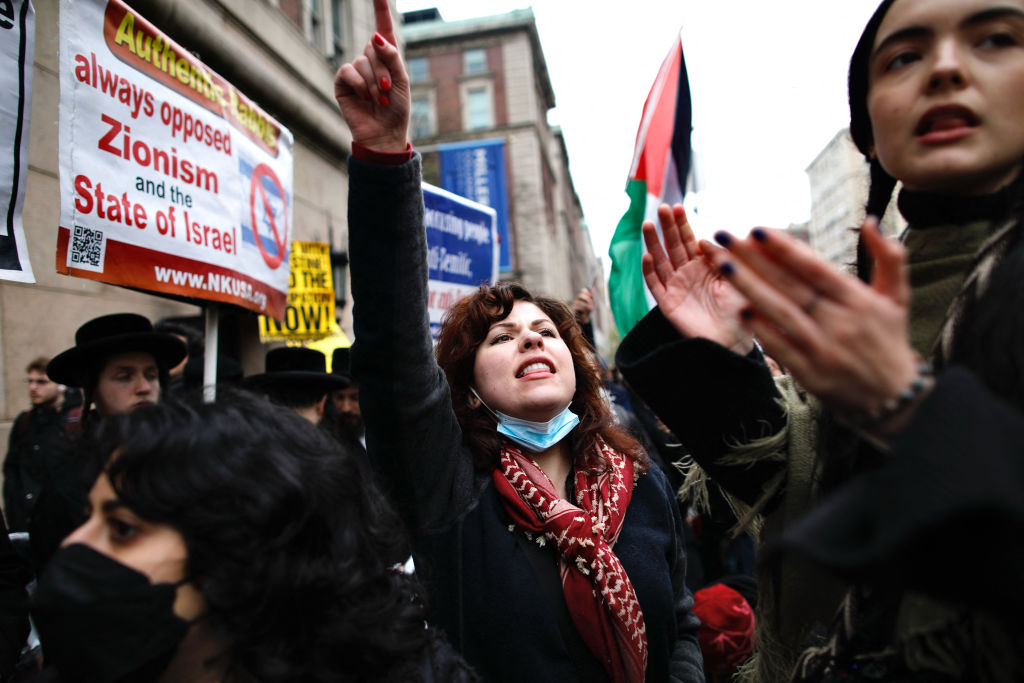 Pro-Palestinian protesters march outside Columbia University in New York City on April 18, 2024.