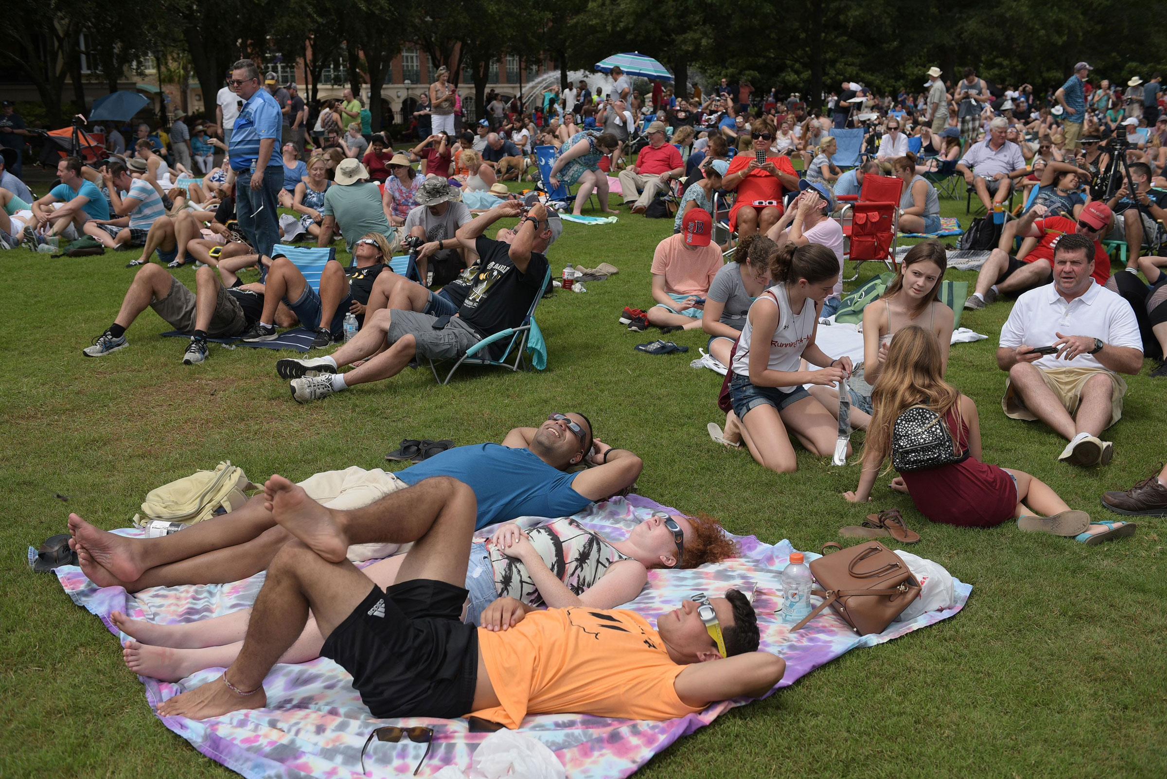 People watch the total solar eclipse in Charleston, South Carolina, on August 21, 2017.