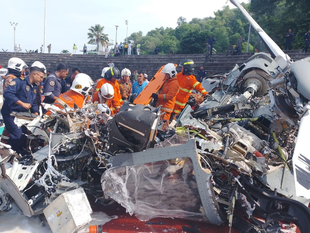 Emergency personnel work at the site of helicopter crash in Lumut, Perak, Malaysia on April 23, 2024.