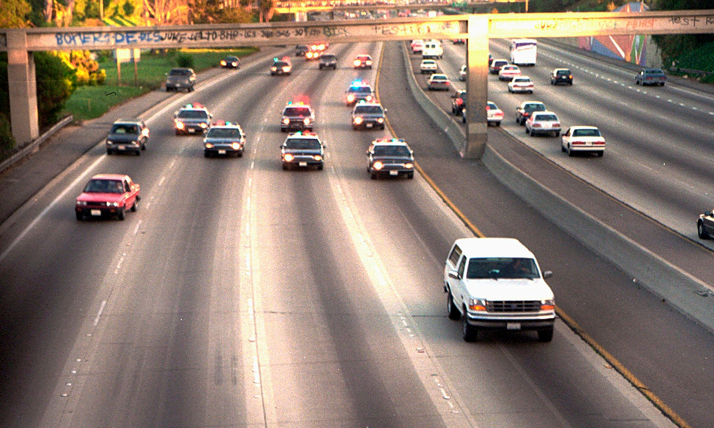 A white Ford Bronco, driven by Al Cowlings carrying O.J. Simpson, is trailed by Los Angeles police cars as it travels on a freeway in Los Angeles on June 17, 1994.