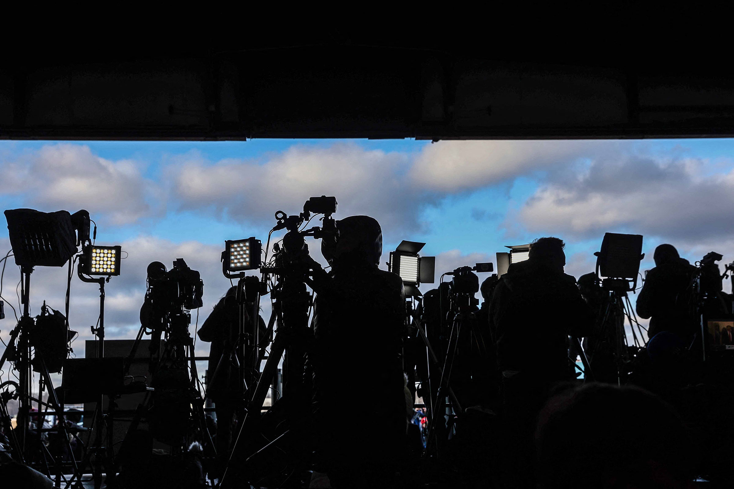 Members of the media wait for the arrival of former President Donald Trump at a "Get Out the Vote" rally in Waterford Township, Michigan, on Feb. 17, 2024.