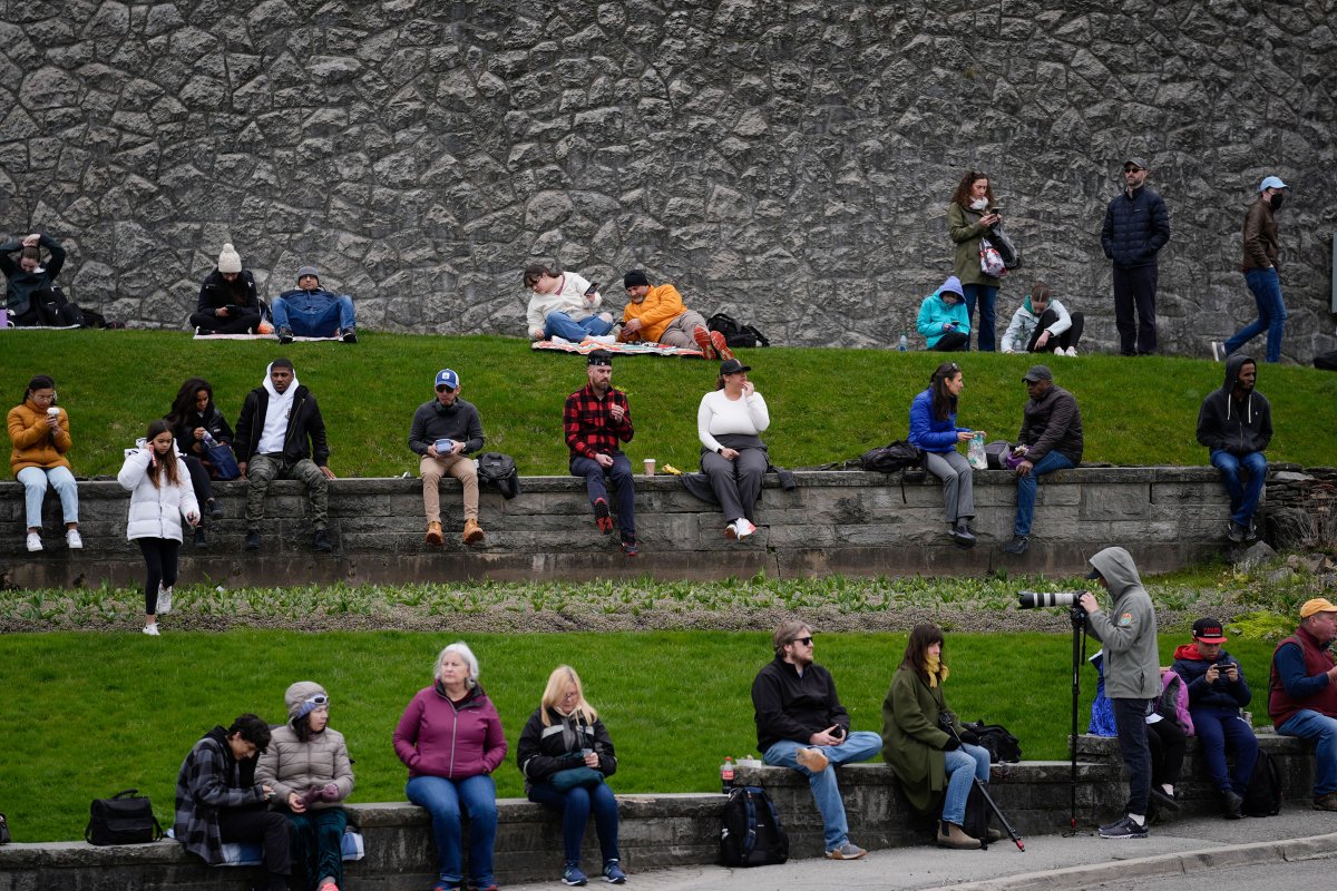People gather under overcast skies in anticipation of watching the total solar eclipse from Niagara Falls, Ontario.