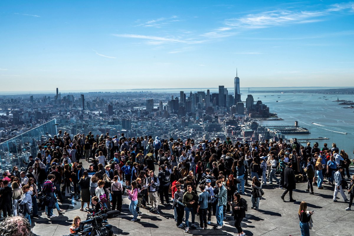 People gather on the observation deck of Edge at Hudson Yards before a partial solar eclipse in New York City.