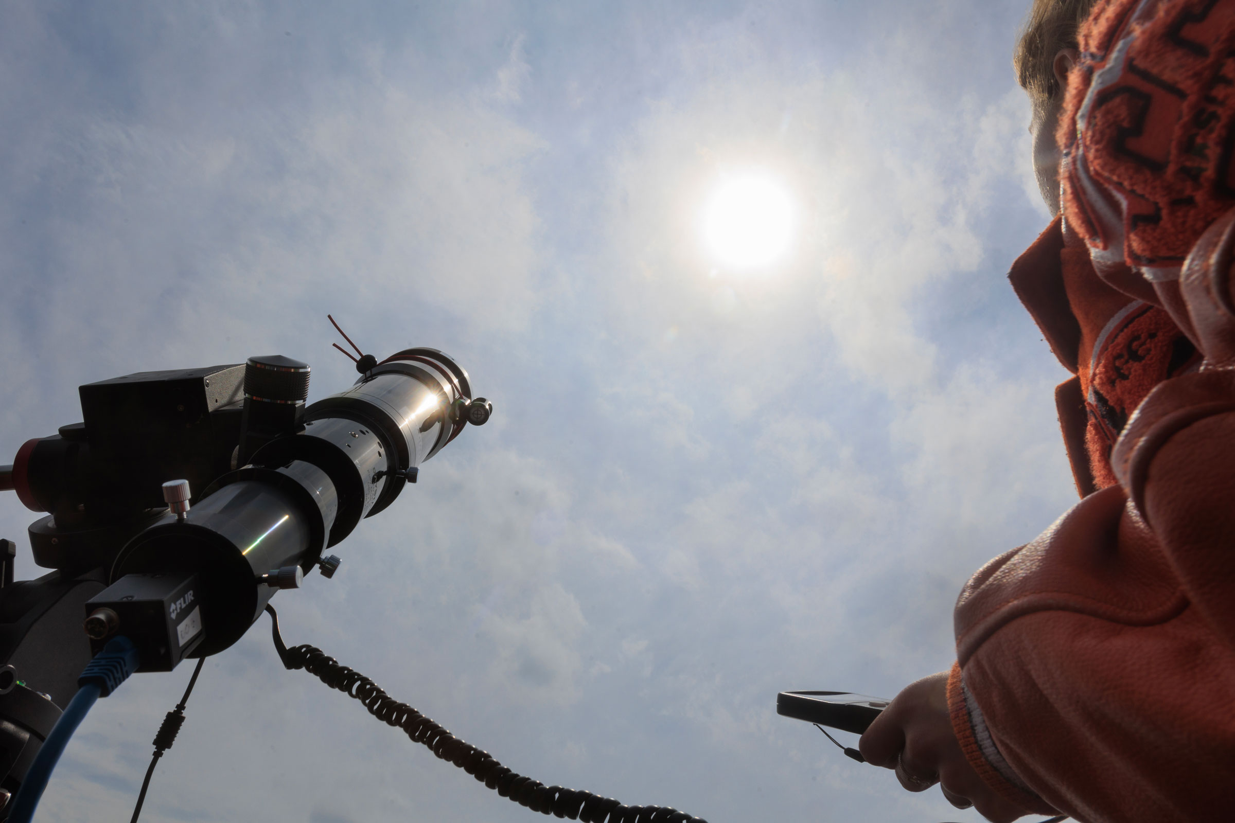 A student calibrates a telescope to follow the position of the sun during a practice session at Kemp High School in Kemp, Texas, on March 24, 2024.