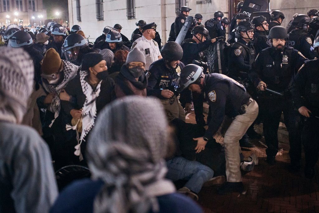 Police remove and arrest protestors outside of Hamilton Hall, April 30, 2024.
