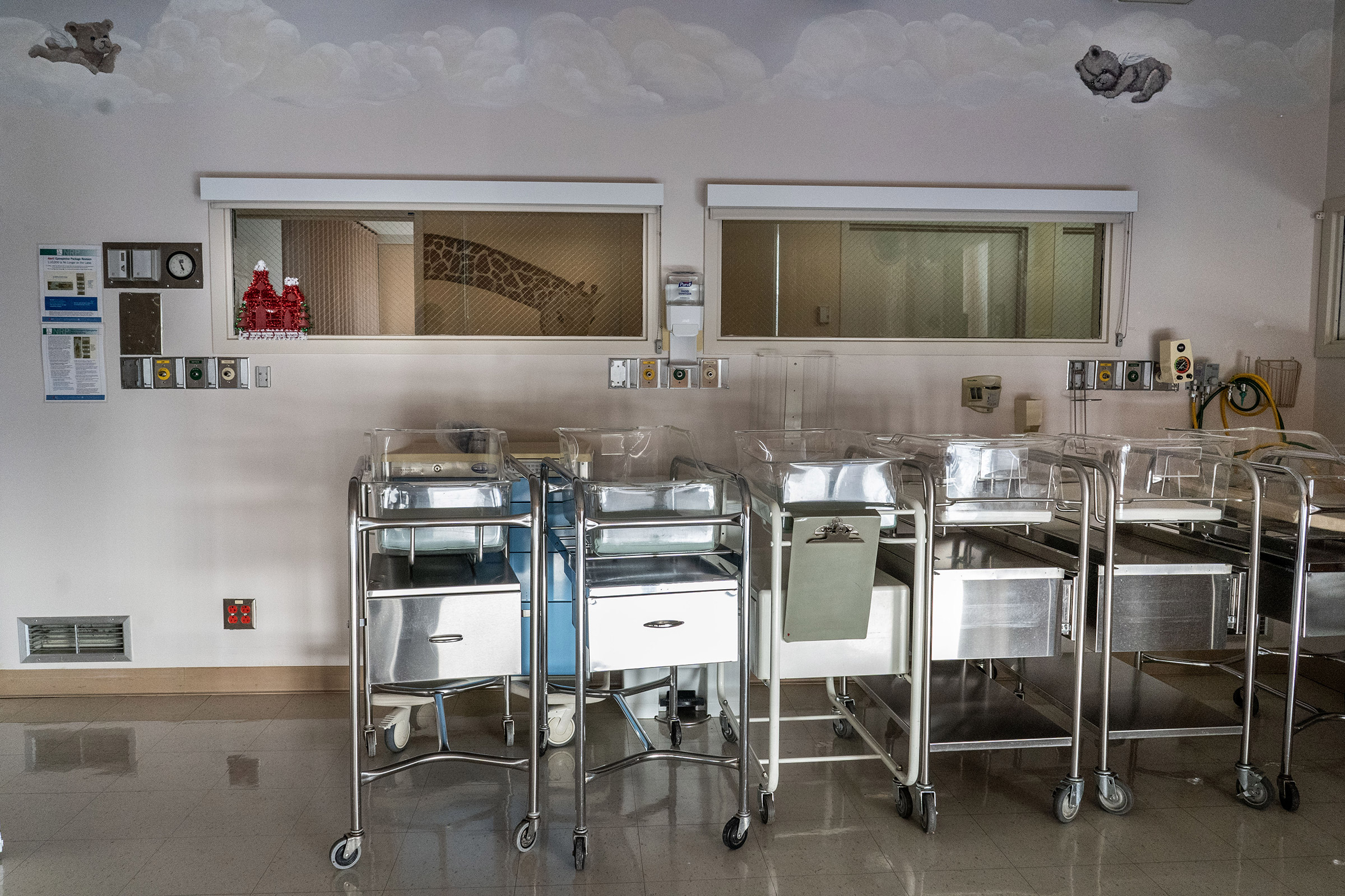Empty infant beds sit gathered in a corner in an empty maternity ward at Madera Community Hospital in Calif., which closed in January 2023, on Sept. 13, 2023. 