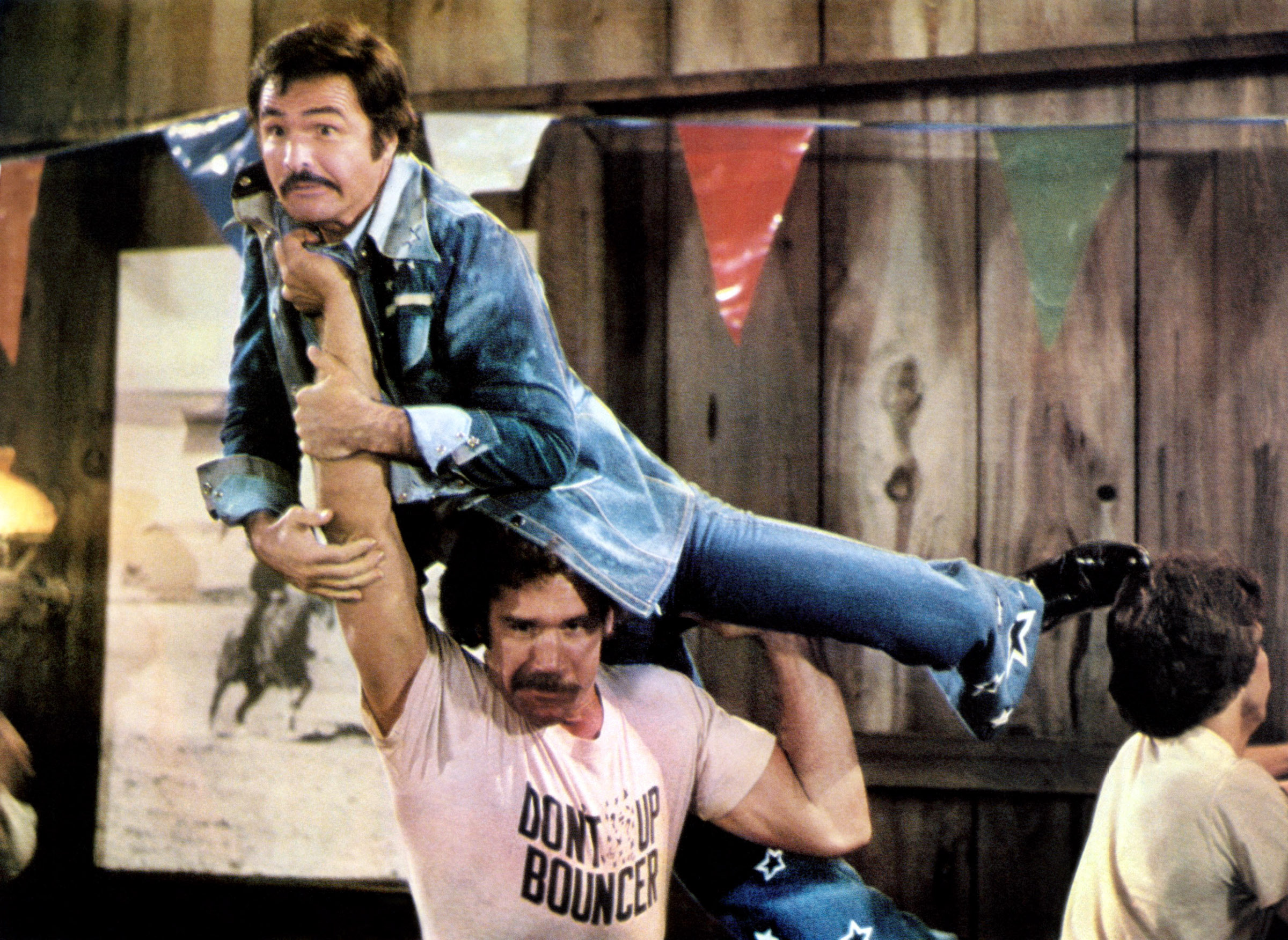 Burt Reynolds (top) in Hooper, 1978